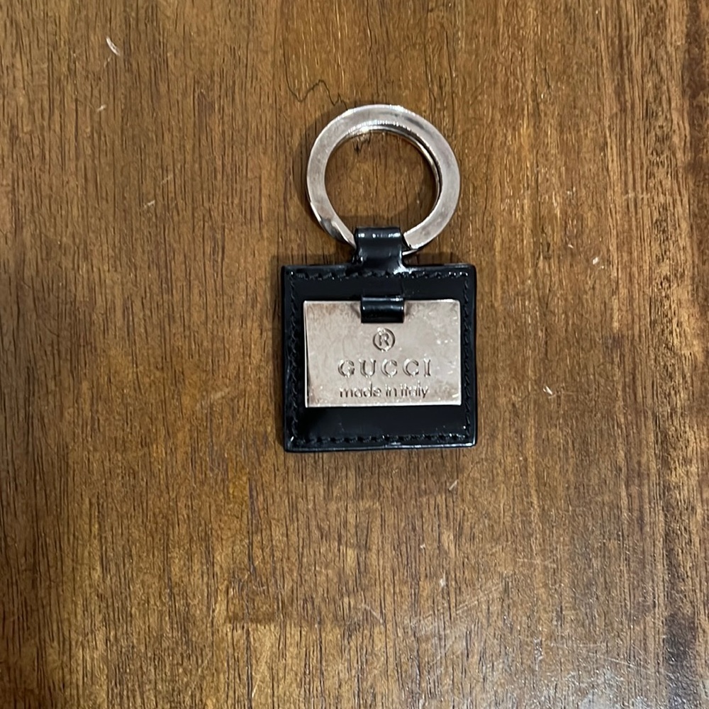 Authentic Gucci vintage black shiny leather key chain. Silver hardware